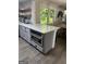 Well-equipped kitchen featuring modern appliances, an island with bar seating, and stylish finishes at 6178 Graceland Cir, Morrow, GA 30260