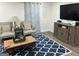Cozy living room with comfortable seating, stylish decor, and a mounted television at 6178 Graceland Cir, Morrow, GA 30260