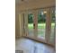 Bright room showcasing marble-look tile flooring and a glass door leading to the outdoors at 6178 Graceland Cir, Morrow, GA 30260