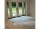 Bright room showcasing marble-look tile flooring and a glass door leading to the outdoors at 6178 Graceland Cir, Morrow, GA 30260