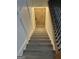 Elegant staircase featuring hardwood steps, decorative railing, and stylish wall paneling at 6178 Graceland Cir, Morrow, GA 30260