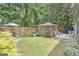 Lush backyard featuring a gazebo, a patio area, a lawn, and mature landscaping at 3347 Sable Glen, Atlanta, GA 30349