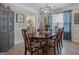 Elegant dining room with modern chandelier, stylish furniture, and hardwood floors at 3347 Sable Glen, Atlanta, GA 30349
