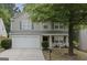 Charming two-story home boasts gray siding, double garage, and mature landscaping at 3347 Sable Glen, Atlanta, GA 30349