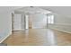 Spacious bedroom featuring wood floors, angular ceilings, and doors to closets and hallway at 128 Rubicon Rd, Peachtree City, GA 30269