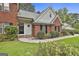 Attractive brick home with a black front door and manicured landscaping at 128 Rubicon Rd, Peachtree City, GA 30269