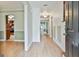 Inviting hallway with light wood floors and neutral paint colors at 128 Rubicon Rd, Peachtree City, GA 30269