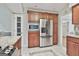 Kitchen featuring stainless steel appliances, granite countertops, and wood cabinetry at 128 Rubicon Rd, Peachtree City, GA 30269