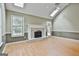Bright living room featuring skylights, vaulted ceilings, and a fireplace at 128 Rubicon Rd, Peachtree City, GA 30269