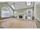 Bright living room with fireplace, skylights, and ample natural light at 128 Rubicon Rd, Peachtree City, GA 30269