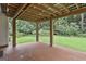 Covered outdoor patio with stained concrete at 128 Rubicon Rd, Peachtree City, GA 30269