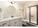 Bright bathroom featuring a large mirror, vanity, and walk-in shower at 4830 Northridge Dr, Cumming, GA 30041
