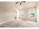 Spacious bedroom with two windows and a walk-in closet at 4830 Northridge Dr, Cumming, GA 30041