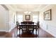 Formal dining room with hardwood floors, decorative molding, and a chandelier at 4830 Northridge Dr, Cumming, GA 30041