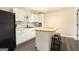 Kitchen with white cabinets, stainless steel appliances, and butcher block island at 4830 Northridge Dr, Cumming, GA 30041