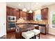 Beautiful kitchen with granite counters, stainless appliances, and center island with counter seating at 4830 Northridge Dr, Cumming, GA 30041