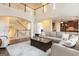 Expansive living room showcases soaring ceilings, open floor plan, and seamless transition to kitchen at 4830 Northridge Dr, Cumming, GA 30041