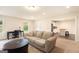 Open-concept living room with hardwood floors and great natural lighting at 4830 Northridge Dr, Cumming, GA 30041