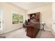 Cozy home office with built-in desk, natural light, and a view of the outdoor scenery at 4830 Northridge Dr, Cumming, GA 30041