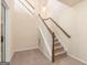 Carpeted stairway with white banister at 4830 Northridge Dr, Cumming, GA 30041