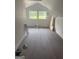 Finished attic space with new floors and natural light from the windows at 1551 Broad Ne St, Conyers, GA 30012