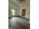 Bright bedroom with new flooring, a window, and fresh paint at 1551 Broad Ne St, Conyers, GA 30012