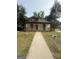 Charming single-story home with a welcoming front porch and mature trees at 1551 Broad Ne St, Conyers, GA 30012
