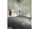 Spacious living room featuring fresh paint and a modern ceiling fan at 1551 Broad Ne St, Conyers, GA 30012