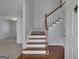 View of the Entryway showing the beautiful stairway and hardwood floors at 115 Rockhurst Chase, Tyrone, GA 30290