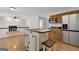Cozy kitchen featuring an island, stainless steel refrigerator, and dark countertops at 115 Rockhurst Chase, Tyrone, GA 30290