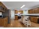 Kitchen with stainless steel appliances and a central island with an eating area at 115 Rockhurst Chase, Tyrone, GA 30290