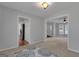 Open Living room with view to the hallway with a view of the front door at 115 Rockhurst Chase, Tyrone, GA 30290