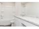 Well-lit bathroom featuring a shower-tub combo and vanity with granite countertop at 235 Oliver Dr, Locust Grove, GA 30248