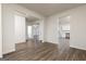 Spacious living room featuring wood-look floors, and an open layout at 235 Oliver Dr, Locust Grove, GA 30248
