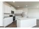Modern kitchen featuring white cabinets, granite countertops, stainless steel appliances and an island at 275 Oliver Dr, Locust Grove, GA 30248