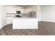 Modern kitchen featuring white cabinets, granite countertops, stainless steel appliances and an island at 275 Oliver Dr, Locust Grove, GA 30248