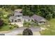A charming home is surrounded by lush greenery and mature trees, complemented by a spacious backyard at 300 Peggy Cole Bridge Rd, Villa Rica, GA 30180