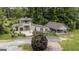 An aerial view showcases the exterior of the house, front lawn, and additional building in the backyard at 300 Peggy Cole Bridge Rd, Villa Rica, GA 30180