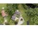 Aerial view featuring a house, pond, well-maintained lawns and mature trees at 300 Peggy Cole Bridge Rd, Villa Rica, GA 30180