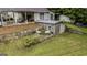 Backyard retaining wall and sheds on a lush green lawn, creating a serene outdoor space at 300 Peggy Cole Bridge Rd, Villa Rica, GA 30180