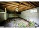 Basement featuring bare floors, cinder block walls, and exposed wooden beams at 300 Peggy Cole Bridge Rd, Villa Rica, GA 30180