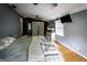 Spacious bedroom featuring hardwood floors, ceiling fan, and a closet at 300 Peggy Cole Bridge Rd, Villa Rica, GA 30180