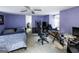 Bedroom featuring light purple walls, carpeted floors, a ceiling fan, and lots of natural light at 300 Peggy Cole Bridge Rd, Villa Rica, GA 30180