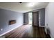 Bedroom featuring laminate floors, AC unit, and sliding glass doors at 300 Peggy Cole Bridge Rd, Villa Rica, GA 30180