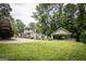 A charming home boasts a well-maintained front yard, exuding curb appeal and welcoming charm at 300 Peggy Cole Bridge Rd, Villa Rica, GA 30180