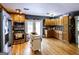 Spacious kitchen featuring wooden cabinetry, stainless steel appliances, and a functional center island at 300 Peggy Cole Bridge Rd, Villa Rica, GA 30180