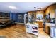 Spacious kitchen with stainless steel appliances, wood cabinets, island, and hardwood flooring at 300 Peggy Cole Bridge Rd, Villa Rica, GA 30180