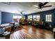 A living room full of boxes with multiple windows and hardwood flooring at 300 Peggy Cole Bridge Rd, Villa Rica, GA 30180