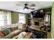 The cozy living room features a rustic wood accent wall, brick fireplace, and comfortable seating at 300 Peggy Cole Bridge Rd, Villa Rica, GA 30180
