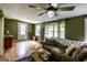 Bright living room with wood floors, comfortable couch and lots of natural light at 300 Peggy Cole Bridge Rd, Villa Rica, GA 30180